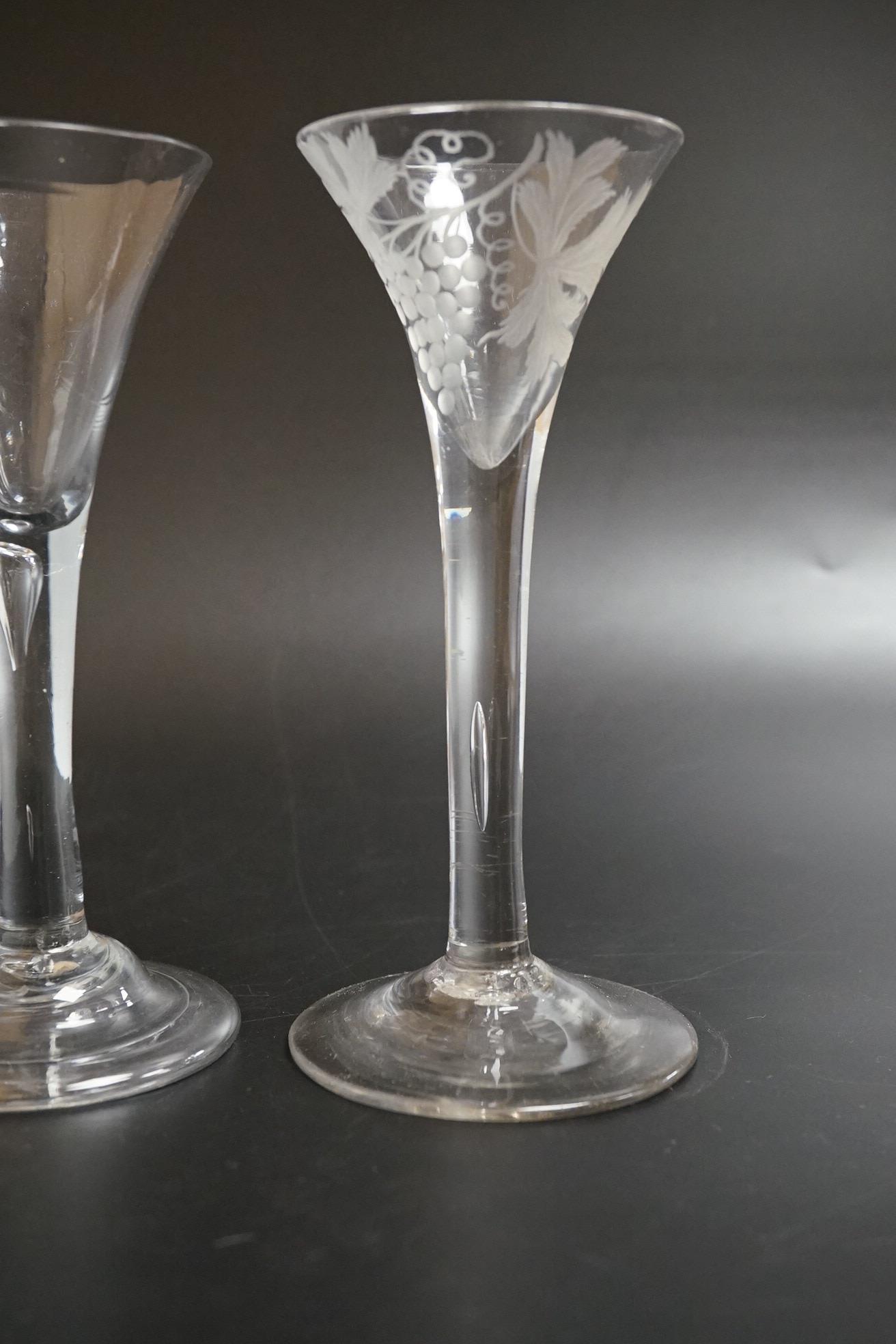 Two 18th century glass wine flutes, one with folded foot, tallest 16cm high